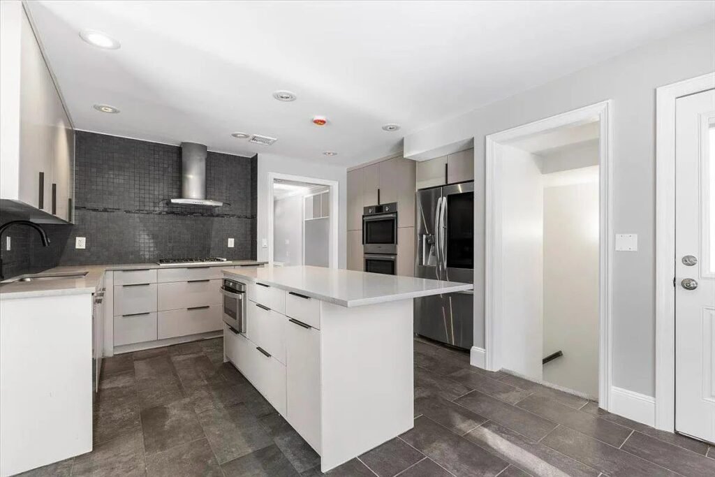 New white kitchen with a quartz island
