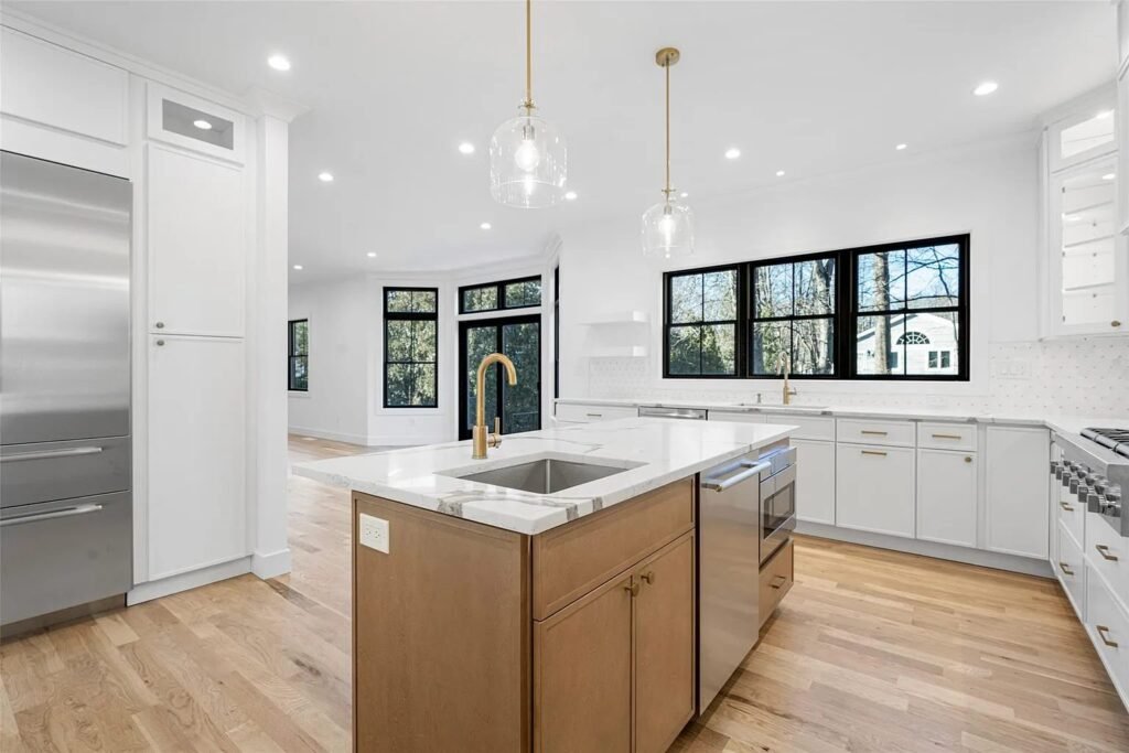 Kitchen with a waterfall island and full-height cabinetry