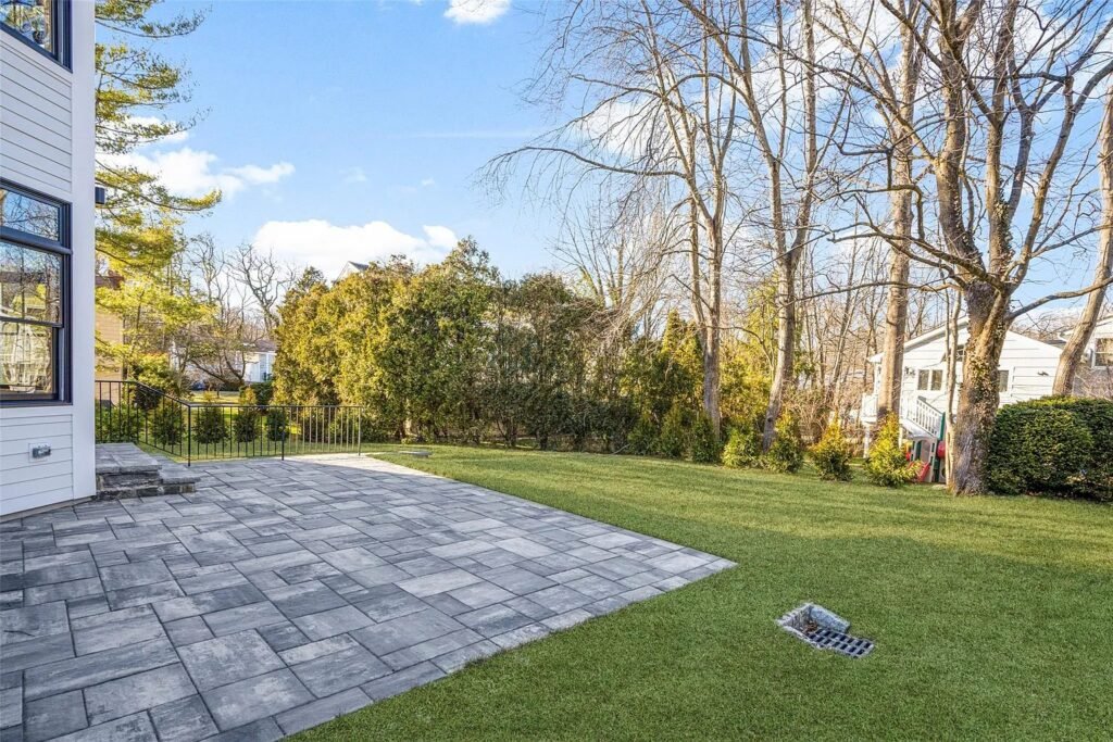 Bluestone paver patio and rear lawn