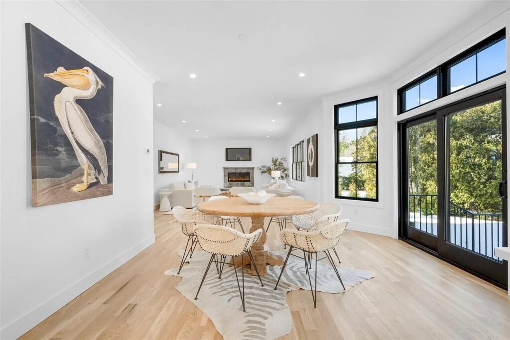 Dining area with black-framed windows and artwork