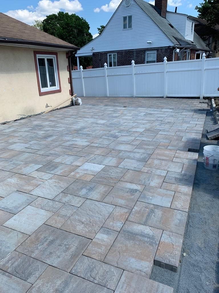 Interlocking paver driveway installed by the Monvestor masonry crew