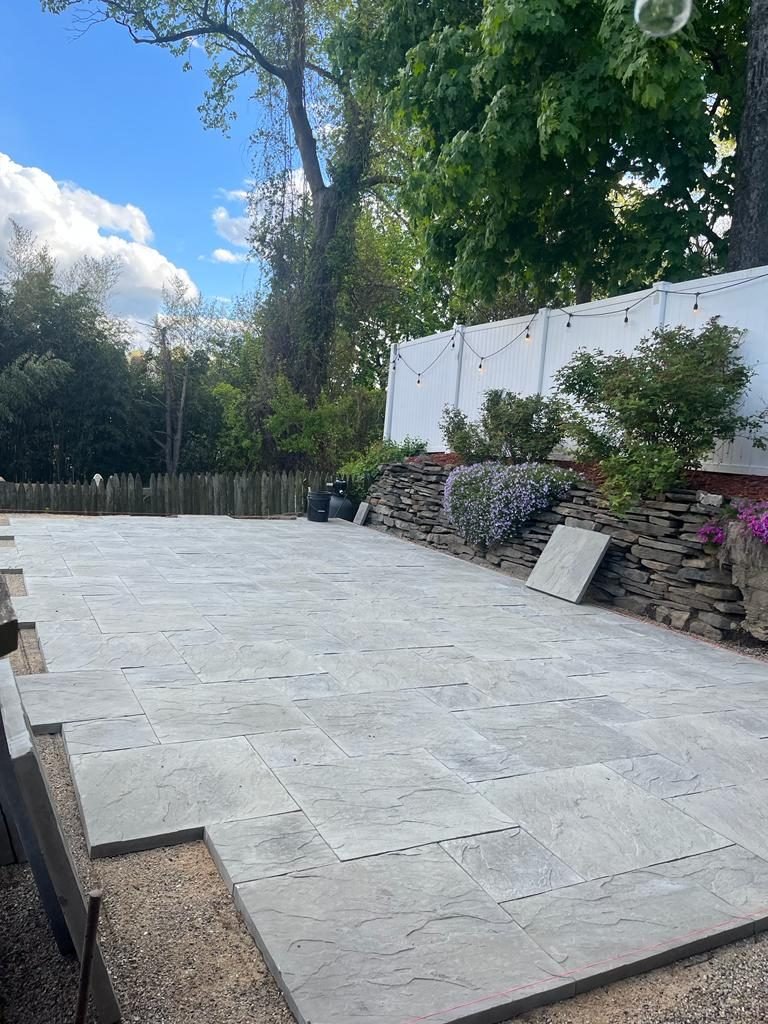 Monvestor masonry crew laying a paver driveway