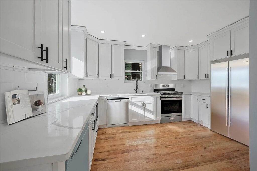 White kitchen with stainless appliances