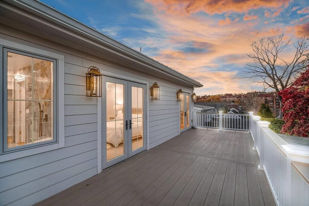 Covered deck at sunset overlooking the rear grounds