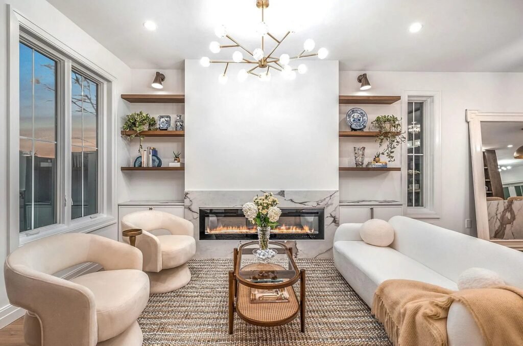 Living room with a linear fireplace and custom built-in shelving
