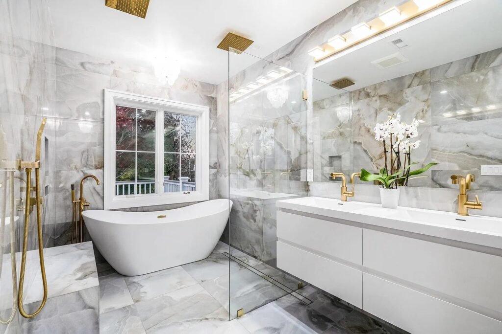 Primary bath vanity in marble with brass fittings