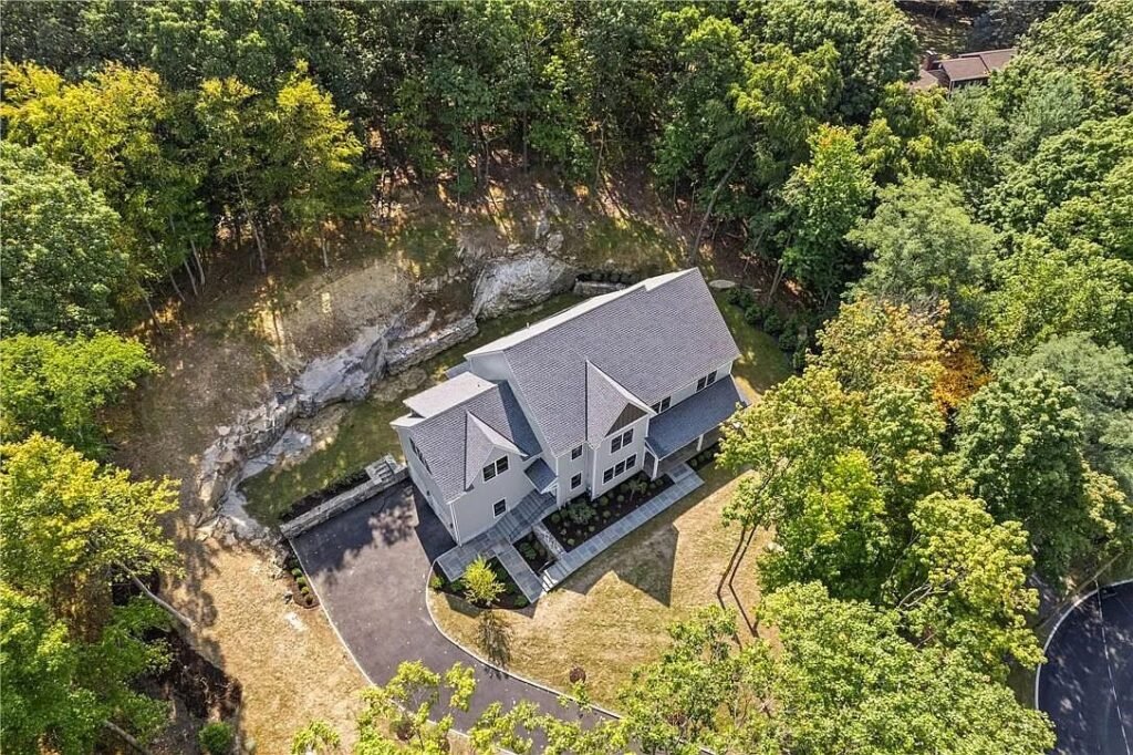 Aerial view showing the roofline and driveway approach
