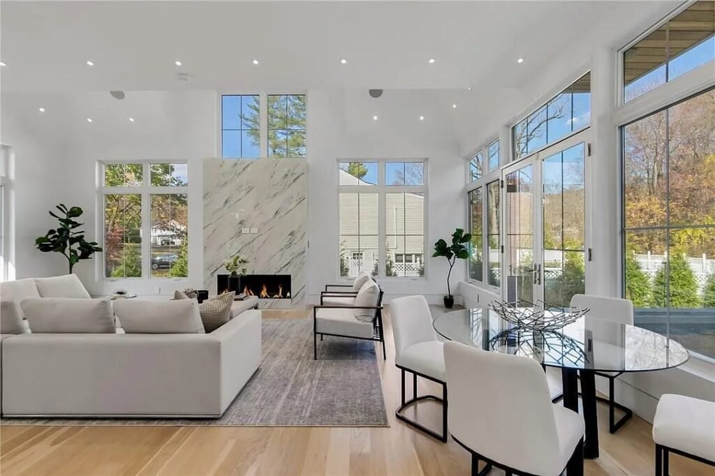 Open living and dining area with wide-plank oak flooring