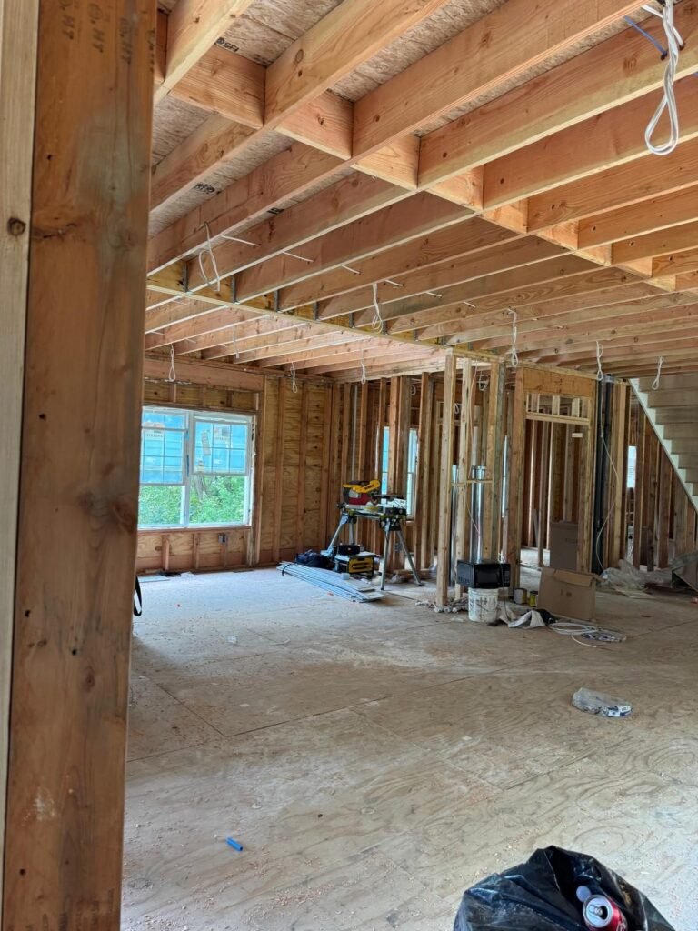 Interior stripped back to bare framing during a full gut renovation