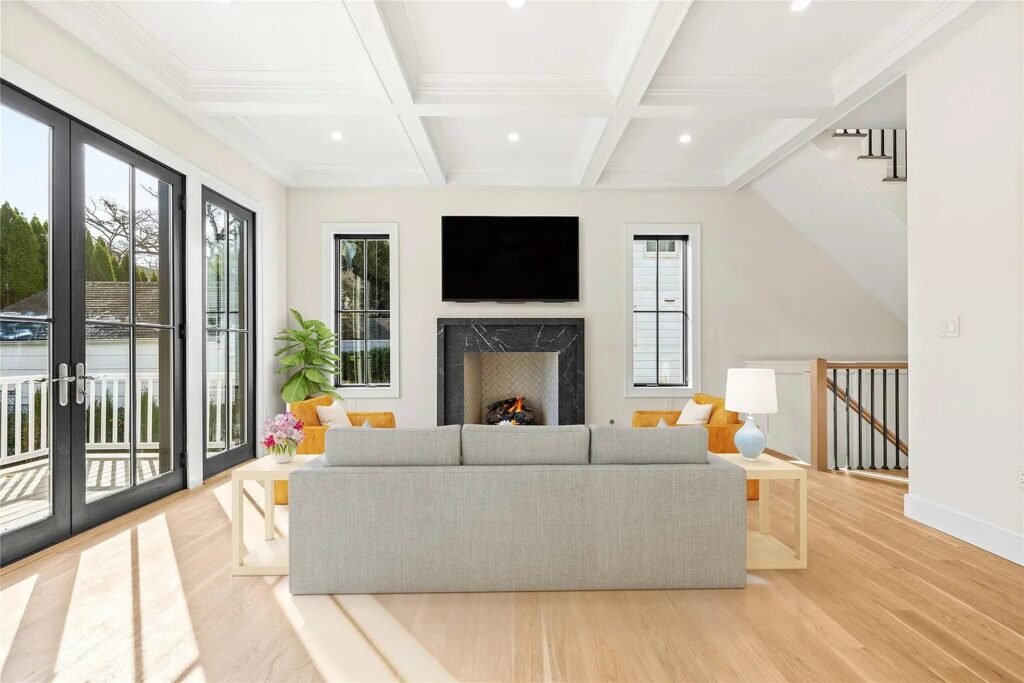 Living room with a fireplace opening onto the rear deck