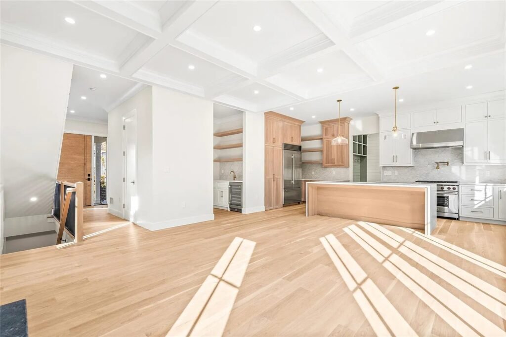 Living room with a coffered ceiling and abundant natural light