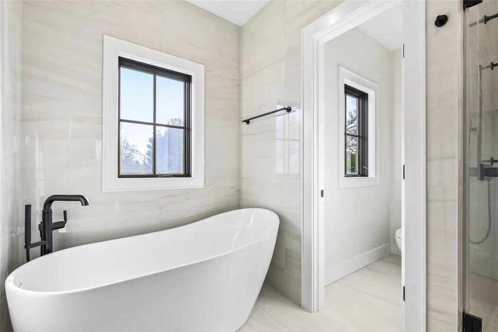 Primary bathroom with a freestanding tub and glass shower